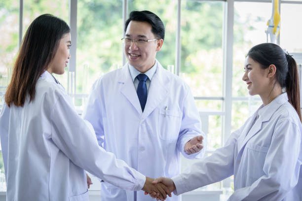 Asian scientist team have meeting in laboratory. Asian scientist team have meeting in laboratory.